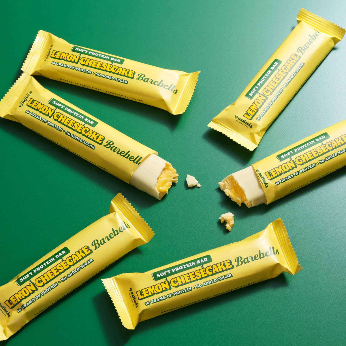 Barebells Soft Protein Bar Lemon Cheesecake - meerdere eiwitrepen op groene achtergrond